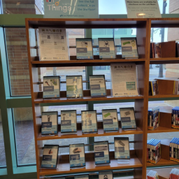 Library of Things bookshelves with assistive technologies displayed